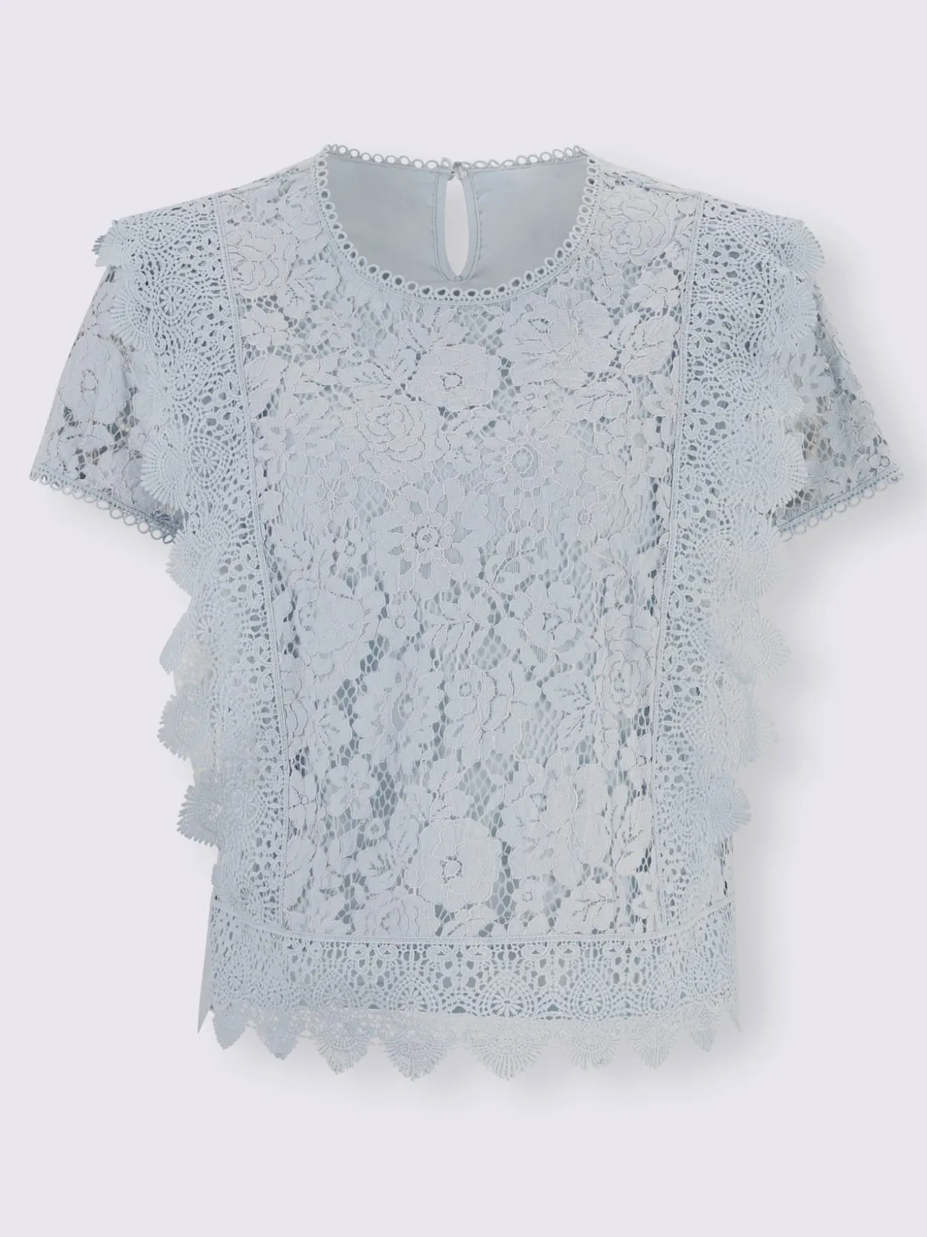 Chemisier en coton avec différents motifs de dentelle