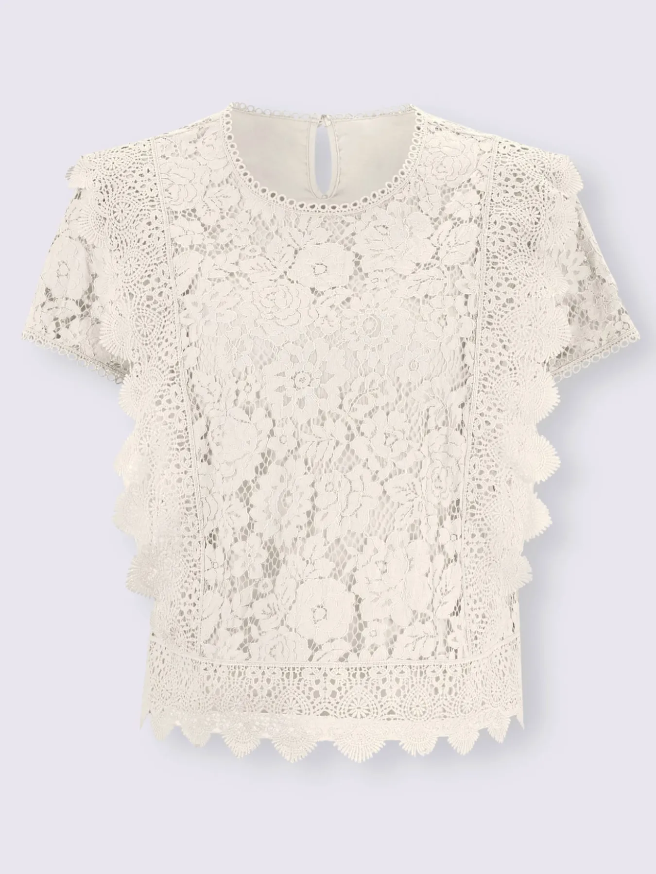 Chemisier en coton avec différents motifs de dentelle