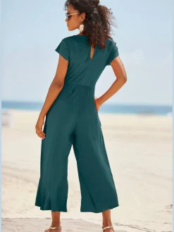 Combinaison pantalon large encolure ronde avec fermeture boutonnée au dos