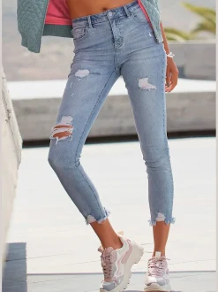 Jean effet déchiré jambes affinées