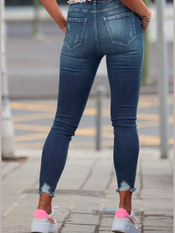 Jean effet déchiré jambes affinées