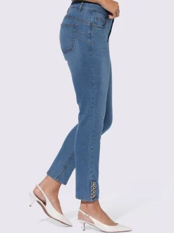 Jean push-up avec œillets et chaînes décoratives