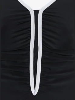 Maillot de bain coupe sportive avec passepoil contrasté