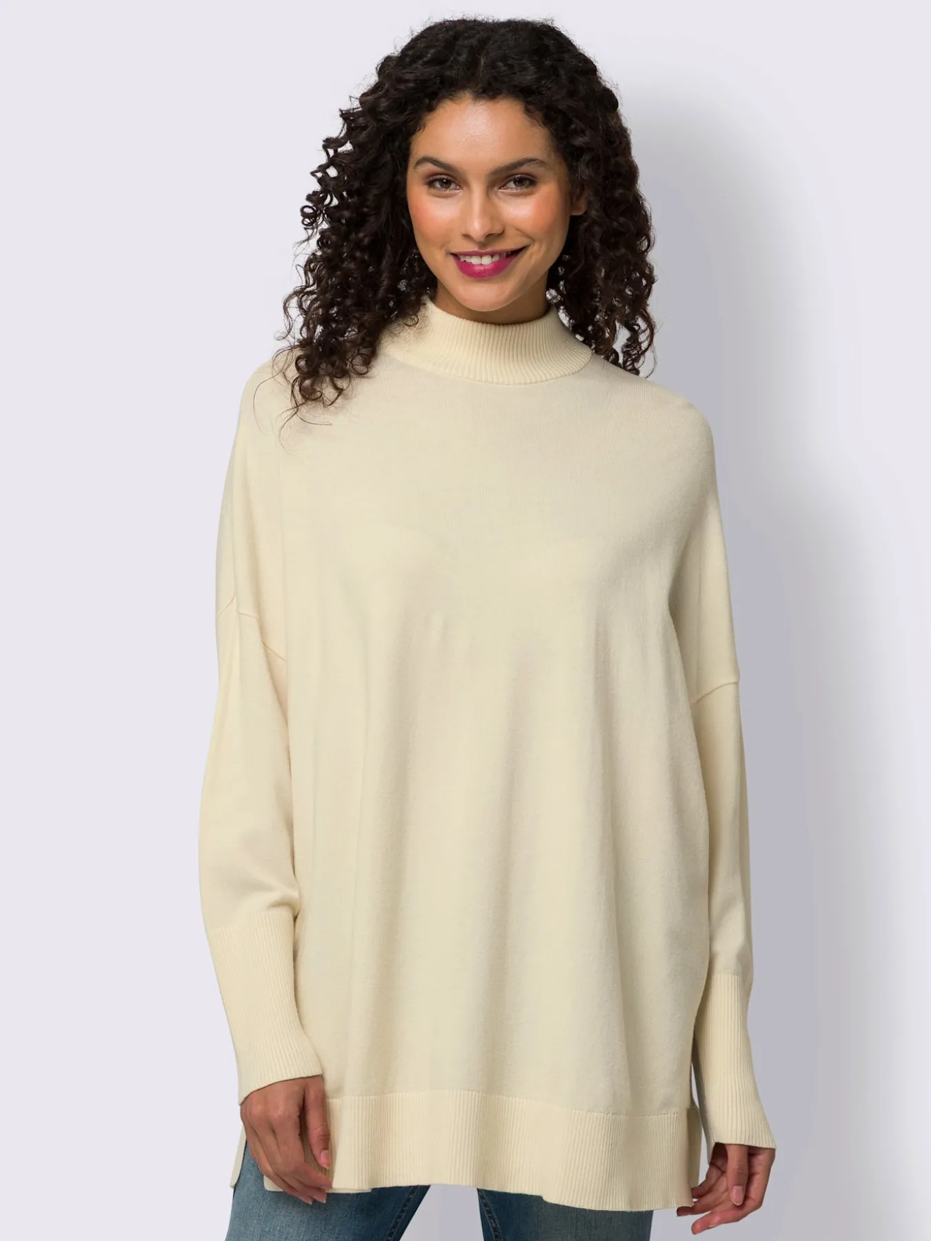 Pull à col montant patte de boutonnage au dos