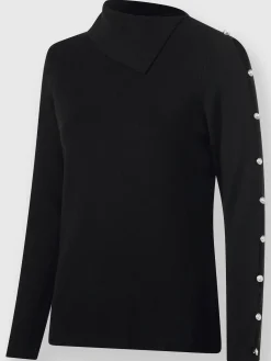 Pull à col roulé découpes raffinées aux manches