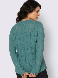 Pull ajouré bord ondulé élégant
