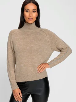 Pull en tricot fils métallisés tissés
