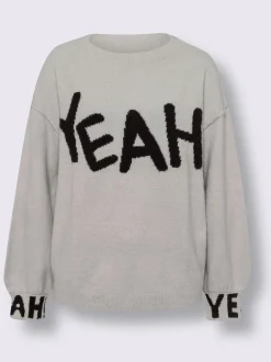 Pull en tricot inscription tendance