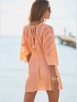 Robe tunique col v chevauchant