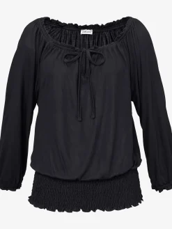 Se porte comme un t-shirt carmen ou sur les épaules