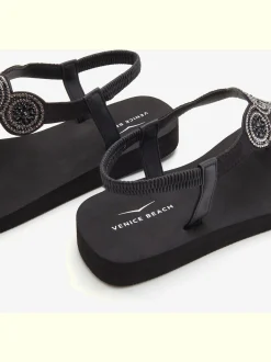 Tongs avec semelle imperméable et applications brillantes